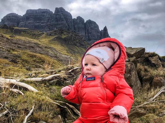 Lara Mills pictured at the Old Man of Storr on Skye. She reached the top of her first Munro - Ben Lomond - aged just four-months-old.
