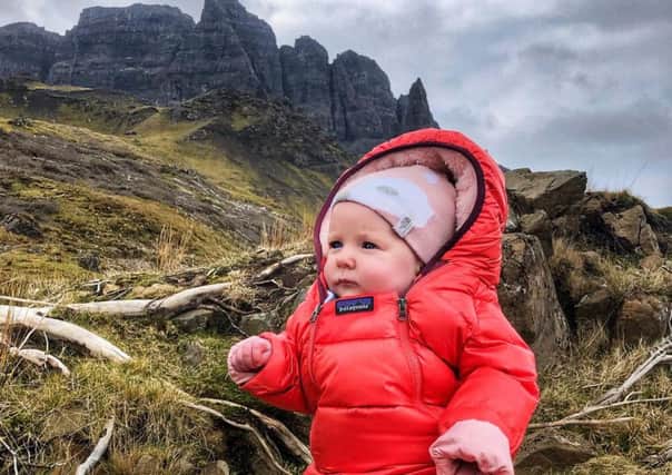 Lara Mills pictured at the Old Man of Storr on Skye. She reached the top of her first Munro - Ben Lomond - aged just four-months-old.