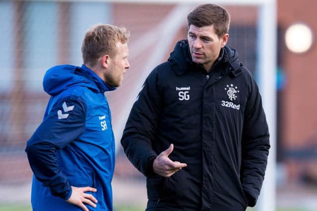 Scott Arfield chats to Steven Gerrard at a Rangers training session at the Hummel Training Centre. Picture: SNS Group