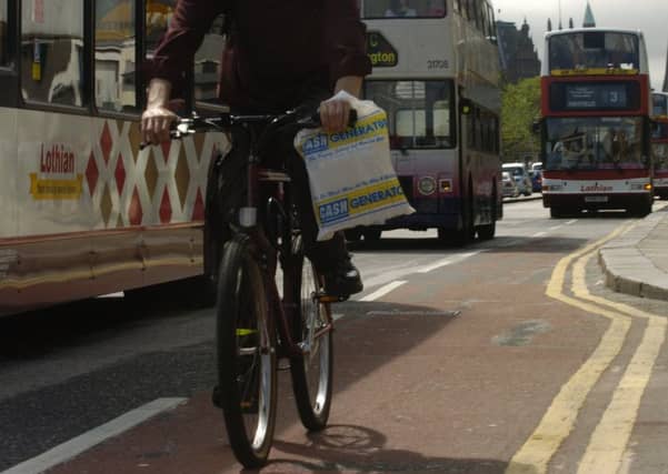 A cyclist on Princes Street in Edinburgh (Picture: Cate Gillon)