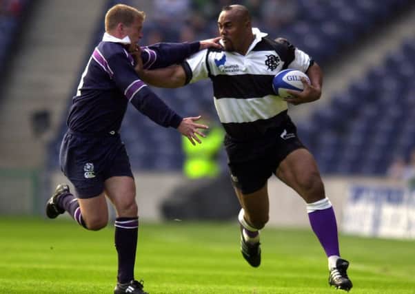 Scotland's Cammy Murray takes on Jonah Lomu , who from an early age was exposed to gang violence. Picture: Ian Rutherford