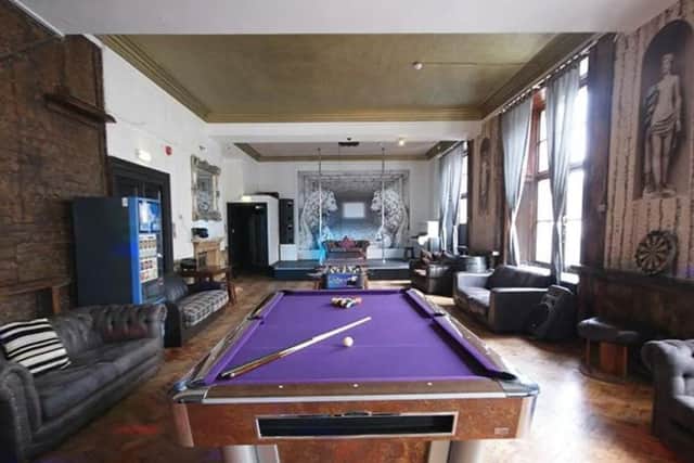 Home to 20 single beds across two bedrooms, this roomy apartment includes all the amenities for a fun night, including a pool table, dance poles, sound system, 50-inch TV and a bar with a beer fridge. Book: https://bit.ly/2Y602Zs