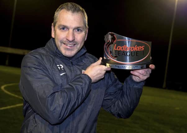 Montrose manager Stewart Petrie with his Ladbrokes League 1 Manager of the Month award for December. Picture: Alan Harvey/SNS