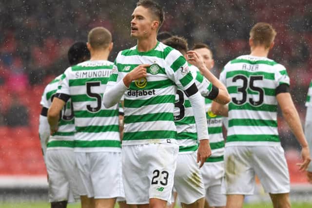 Celtic's Mikael Lustig celebrates his opener. Pic: SNS/Craig Williamson