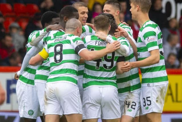 Celtic's Jozo Simunovic celebrates his goal with team mates. Pic: SNS/Paul Devlin
