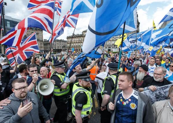 Unionists and Scottish independence supporters during a march by the latter