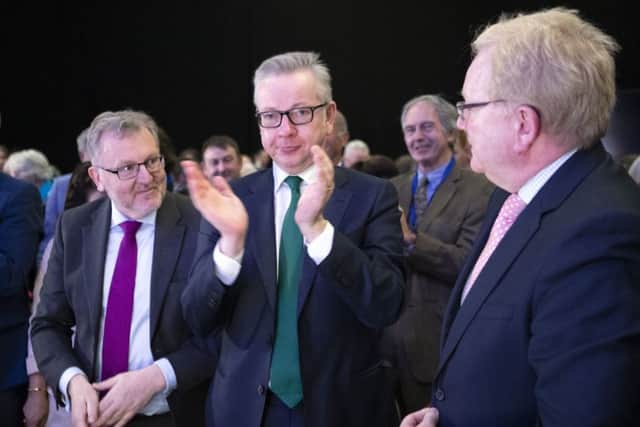David Mundell, Michael Gove and Jackson Carlaw applaud Scottish Conservative leader Ruth Davidson after she delivered her keynote speech. Picture: PA
