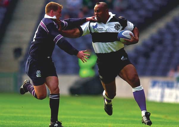 Scotland's Cammy Murray takes on Jonah Lomu , who from an early age was exposed to gang violence. Picture: Ian Rutherford