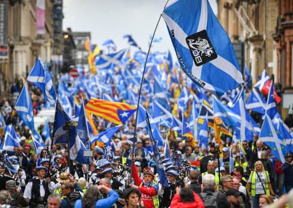 Thousands of independence supporters march during The All Under One Banner event