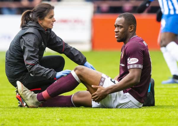 Hearts' Uche Ikpeazu goes off with an apparent hamstring injury in the second half. Pic: SNS/Ross Parker