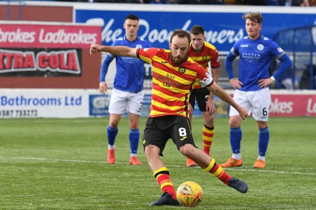 Partick's Stuart Bannigan makes it 3-0 from the spot. Pic: SNS/Sammy Turner