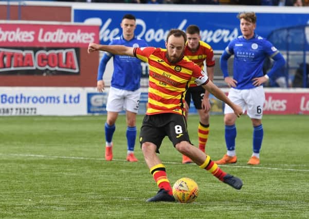 Partick's Stuart Bannigan makes it 3-0 from the spot. Pic: SNS/Sammy Turner