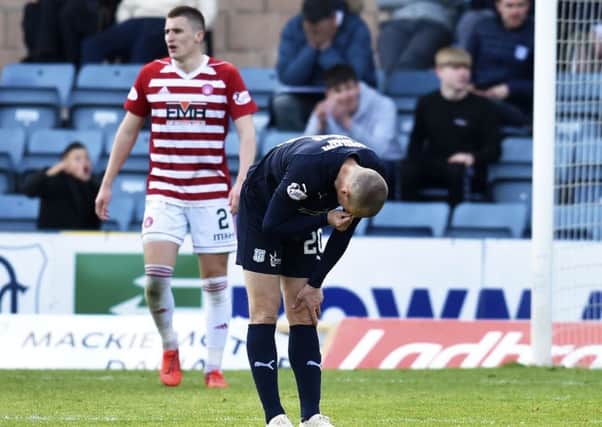 Dundee's Kenny Miller looks dejected as Dundee are relegated. Pic: SNS/Rob Casey