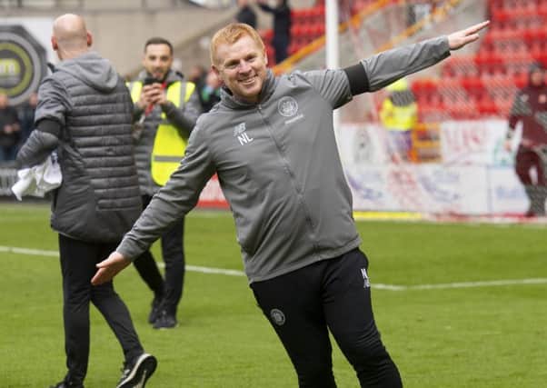 Celtic manager Neil Lennon celebrates winning the league. Pic: SNS/Craig Foy