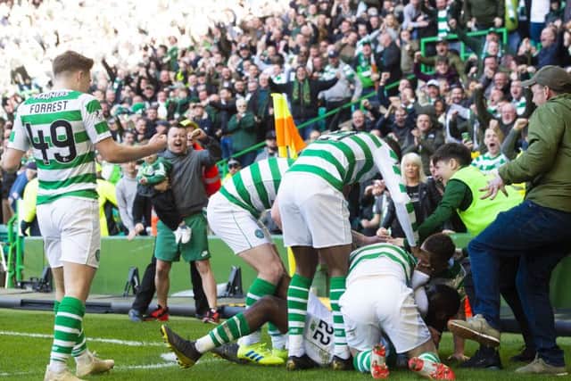 Odsonne Edouard celebrates with teammates during the 2-1 win over Rangesr in March. Pic: SNS