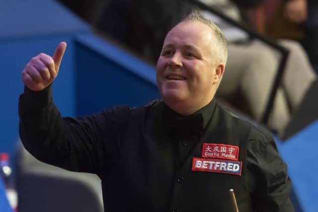 John Higgins celebrates his semi-final victory. Picture: Dave Howarth/PA Wire