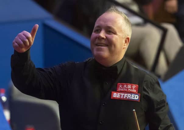 John Higgins celebrates his semi-final victory. Picture: Dave Howarth/PA Wire