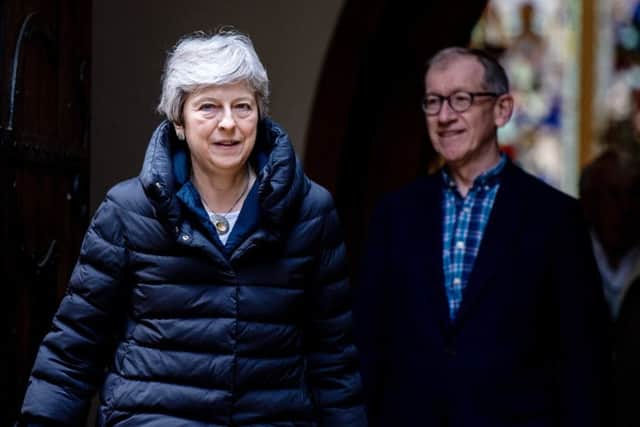 Theresa May and her husband Philip leave after attending a Sunday service at her local church on May 5. Picture: Getty