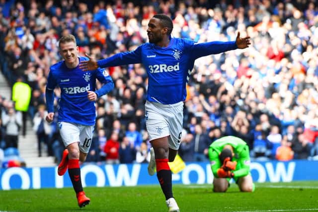 Jermain Defoe celebrates after scoring to give Rangers a 1-0 lead over Hibernian. Picture: SNS.