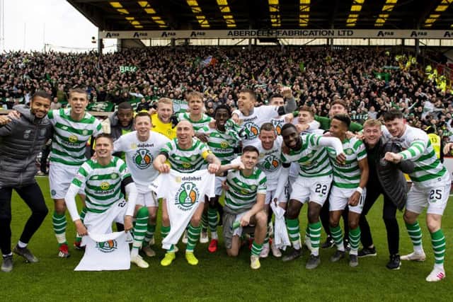 Celtic's players celebrate at full time after winning the Ladbrokes Premiership title. Picture: SNS