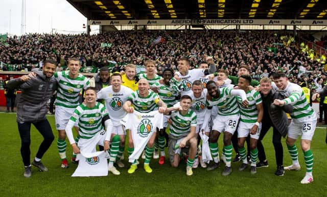 Celtic's players celebrate at full time after winning the Ladbrokes Premiership title. Picture: SNS