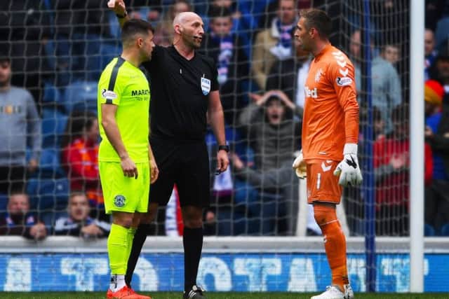 Rangers Alan McGregor is sent off for kicking out at Marc McNulty. Picture: SNS