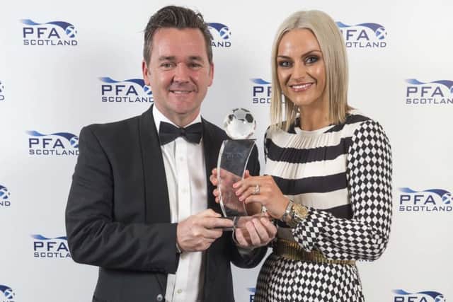 Former Celtic player Andy Walker and singer Amy Macdonald collecting James Forrest's Player of the Year trophy. Picture: PA