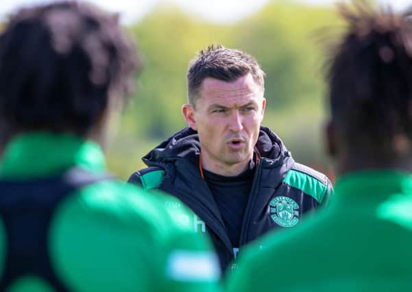 Paul Heckingbottom speaks to his players at Hibs' East Mains training centre. Picture: SNS Group