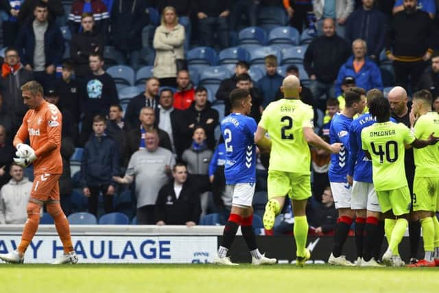 Allan McGregor gets his marching orders at  Ibrox yesterday after kicking out at Hibs  Marc McNulty.