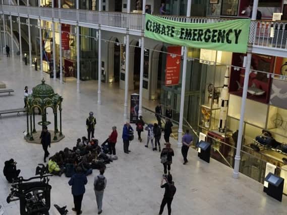 Extinction Rebellion Scotland protesters occupied the National Museum Scotland to disrupt Scottish Oil Club dinner