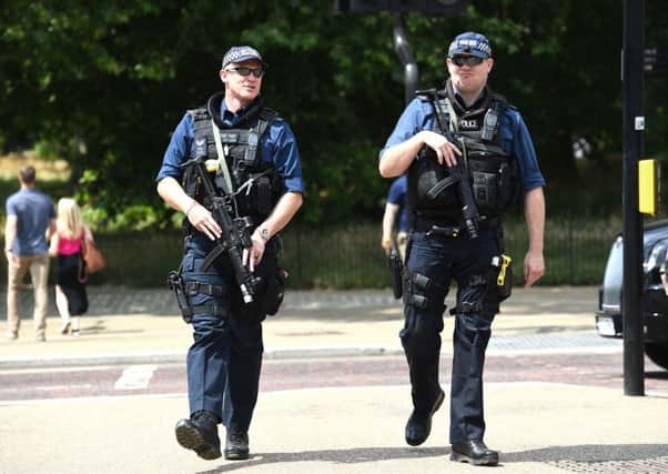 Armed police officers on patrol. Picture: Kirsty O'Connor/PA Wire