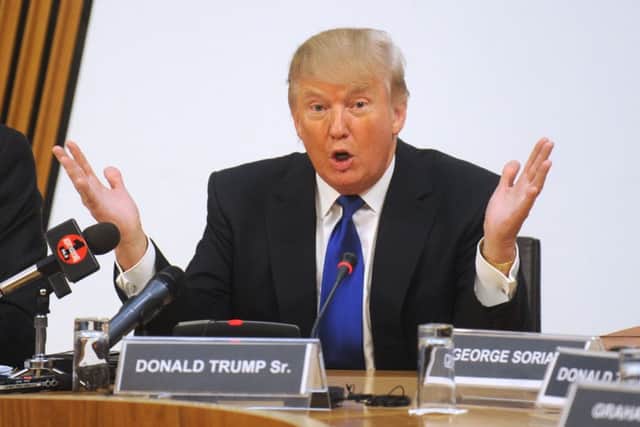 Donald Trump attends an inquiry into the Scottish Government's renewable energy targets in Committee Room 1 at the Scottish Parliament