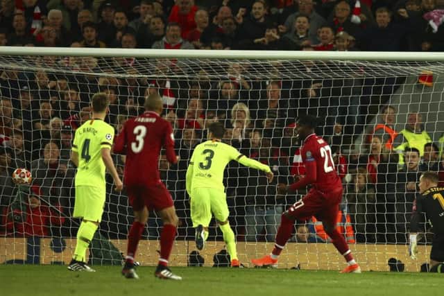 Divock Origo scores Liverpools fourth goal to complete their comeback against Barcelona and send the Merseysiders  to the Champions League final. Picture: AP.
