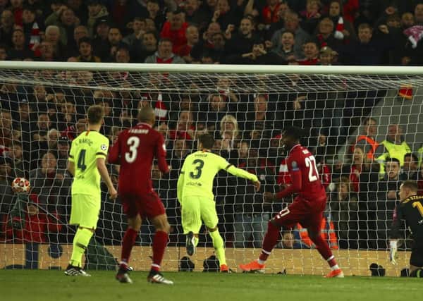 Divock Origo scores Liverpools fourth goal to complete their comeback against Barcelona and send the Merseysiders  to the Champions League final. Picture: AP.