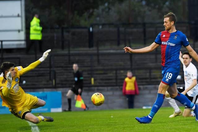 Inverness Caley Thistle striker Jordan White clips the ball over Ayr keeper Ross Doohan to score his first goal of the game. Picture: SNS