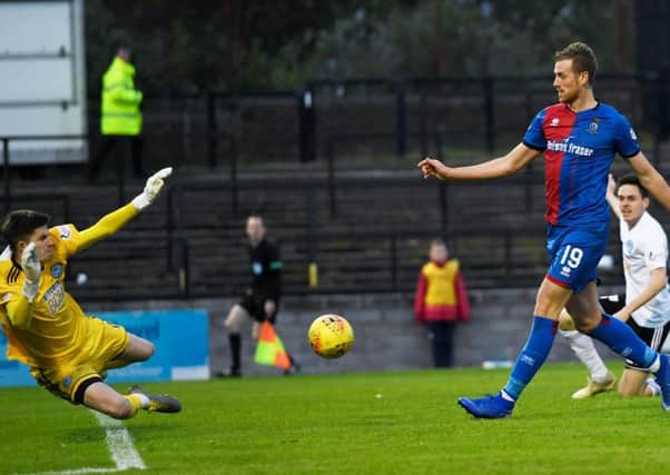 Inverness Caley Thistle striker Jordan White clips the ball over Ayr keeper Ross Doohan to score his first goal of the game. Picture: SNS