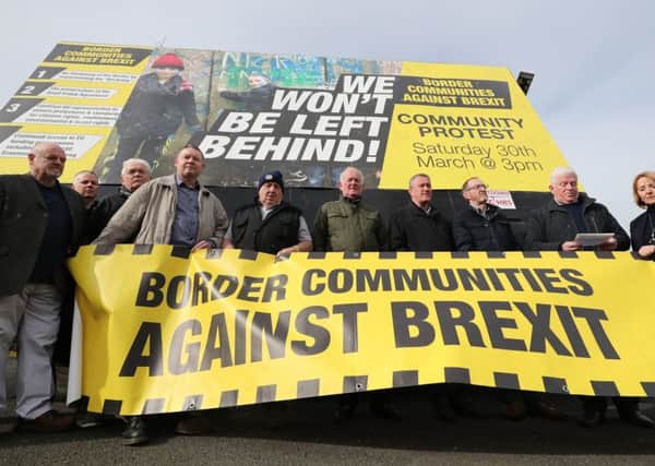 Members of Border Communities Against Brexit protest on the irish border (Picture: Niall Carson/PA Wire)