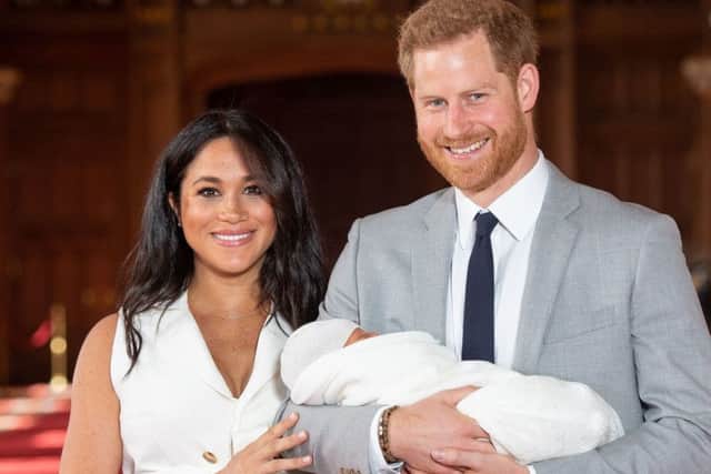 The Duke and Duchess of Sussex with their baby son, who was born on Monday morning, during a photocall in St George's Hall at Windsor Castle. Picture: Dominic Lipinski/PA Wire