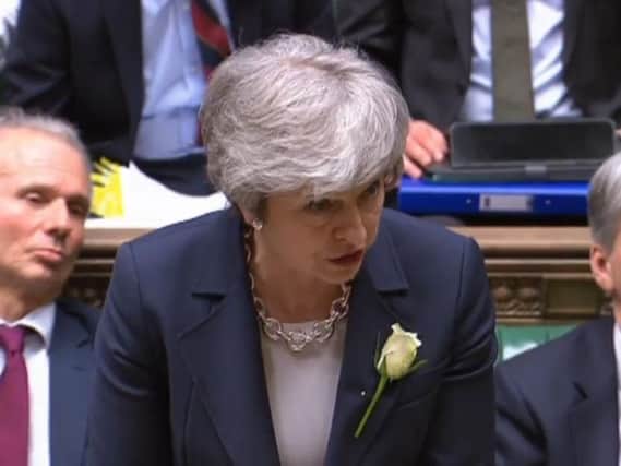 Theresa May faced calls to quit from her own MPs during PMQs