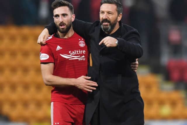 Derby County-bound Graeme Shinnie with Aberdeen boss Derek McInnes, who is facing a summer rebuilding job at Pittodrie. Picture: SNS