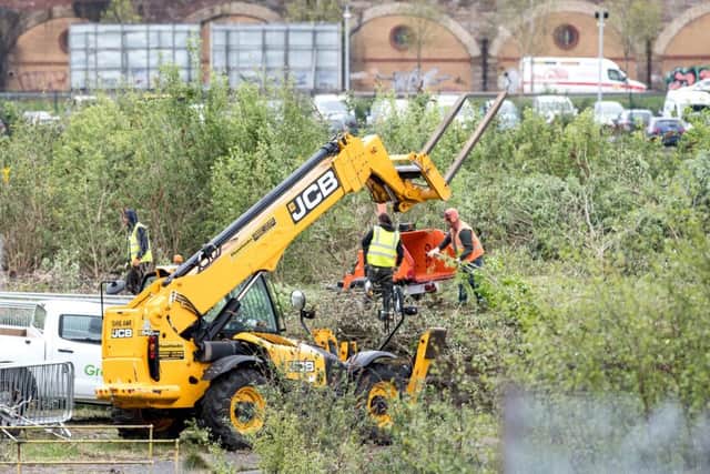 Workers are already clearing bushes to create space for the set, which lies near the Clydside Distillery.