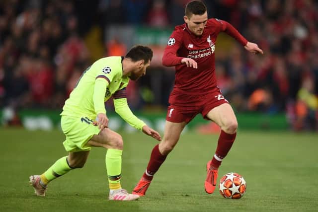Andrew Robertson gets the better of Barcelona's  Lionel Messi on Tuesday evening. Picture: Oli Scarff/AFP/Getty