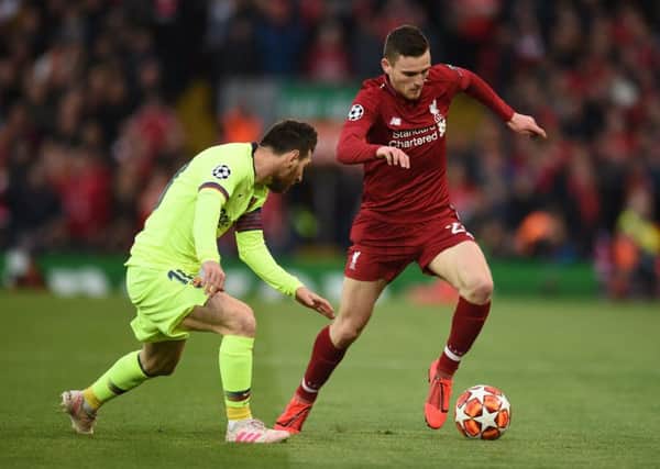 Andrew Robertson gets the better of Barcelona's  Lionel Messi on Tuesday evening. Picture: Oli Scarff/AFP/Getty