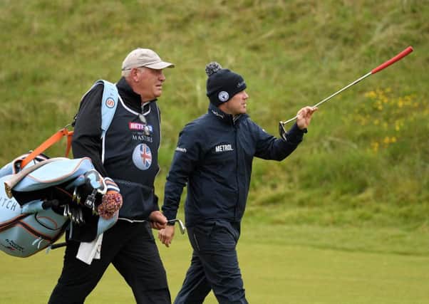Richie Ramsay walks down the 8th with caddie Guy Tilston. Picture: Ross Kinnaird/Getty