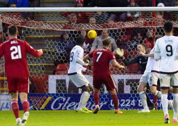 Greg Stewart's shot flies past Hearts goalkeeper Colin Doyle to secure Aberdeen's 2-1 victory at Pittodrie. Picture: Craig Foy/SNS