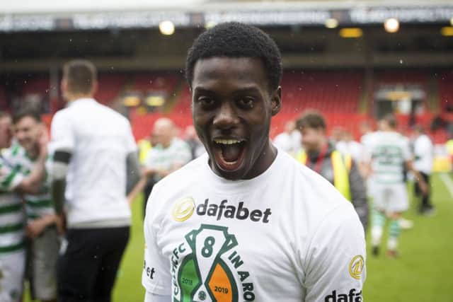 Timothy Weah celebrated Celtic's title win at Pittodrie. Pic: SNS/Paul Devlin