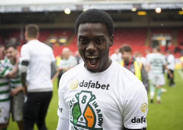 Timothy Weah celebrated Celtic's title win at Pittodrie. Pic: SNS/Paul Devlin