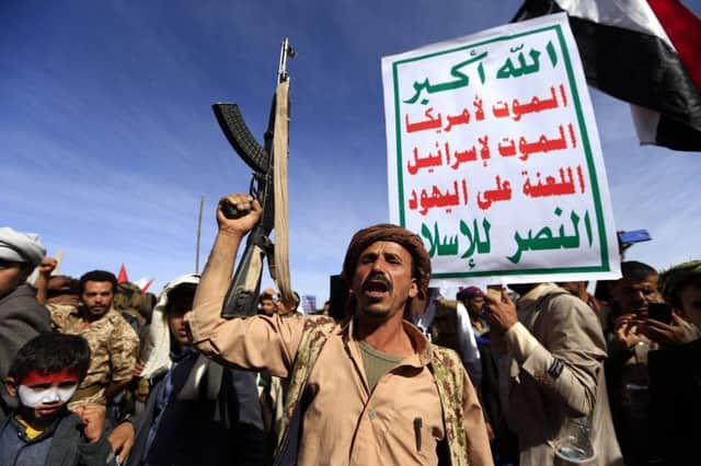 TOPSHOT - Supporters of Yemen's Huthi rebels attend a rally marking the fourth anniversary of the Saudi-led coalition's intervention in Yemen, in the capital Sanaa on March 26, 2019. - A Saudi-led military coalition entered Yemen in March 2015 with the goal of restoring its "legitimate" government to power after the Huthis and their allies took over Sanaa. (Photo by MOHAMMED HUWAIS / AFP)        (Photo credit should read MOHAMMED HUWAIS/AFP/Getty Images)