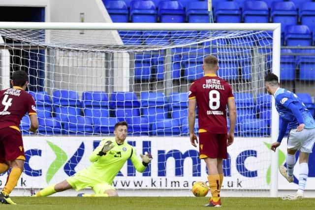 St Johnstone's Scott Tanser drills a penalty past Motherwell's Mark Gillespie to open the scoring. Pic: SNS/Rob Casey