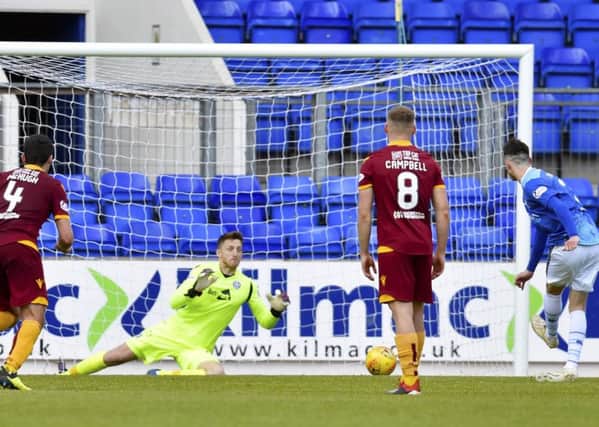 St Johnstone's Scott Tanser drills a penalty past Motherwell's Mark Gillespie to open the scoring. Pic: SNS/Rob Casey